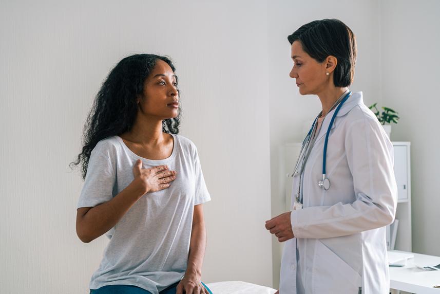 Woman talking to doctor